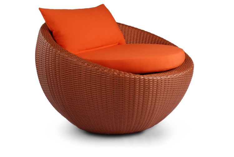 wicker circle chair with orange cushion