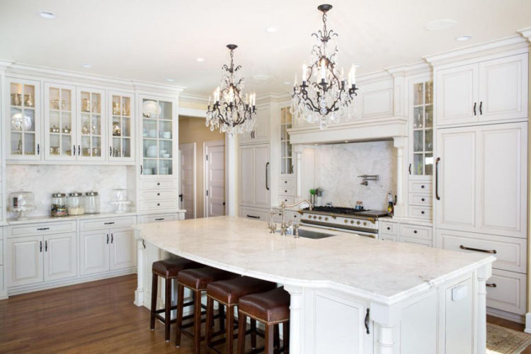 luxury kitchen with two chandeliers