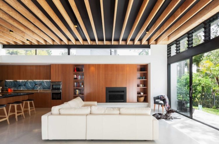 living room with wooden slats on ceiling