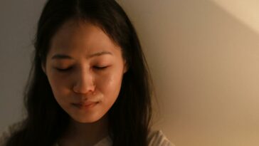 A Crying Woman with Her Eyes Closed