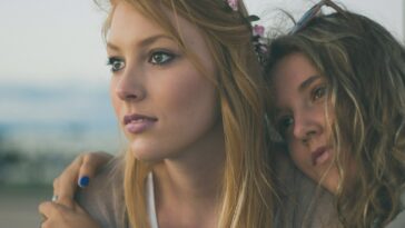 two women close up photography