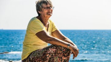 woman sitting on seashore