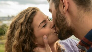 Man and Woman Kiss Each Other