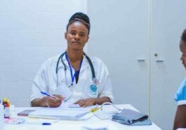 doctor sitting at the table in front of girl
