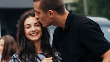 Photo of Man Kissing Woman's Forehead