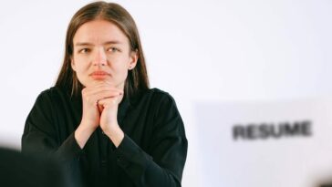 Woman in Black Long Sleeve Shirt Having a Job Interview