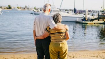 Elderly Couple Standing on the Shore