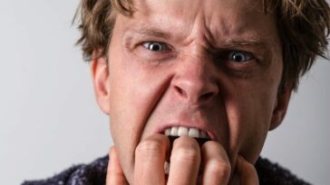 man in blue and white long sleeve shirt