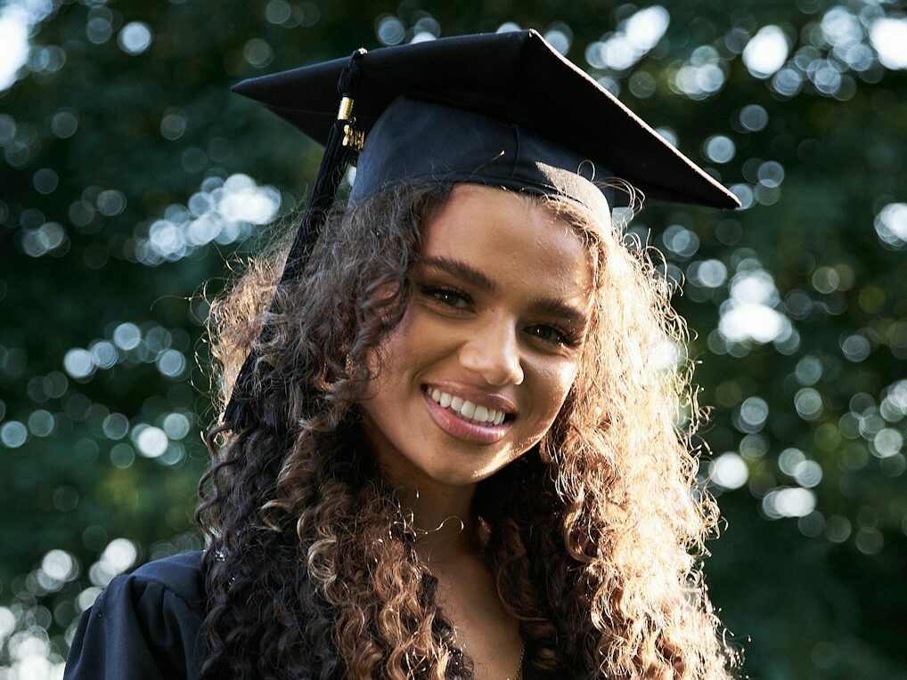 woman in black academic gown