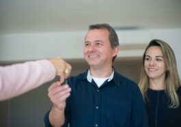 A Couple Receiving Keys from a Broker