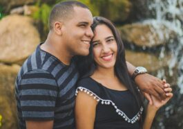 man and woman taking picture while holding their hands
