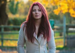 woman in gray zip-up jacket