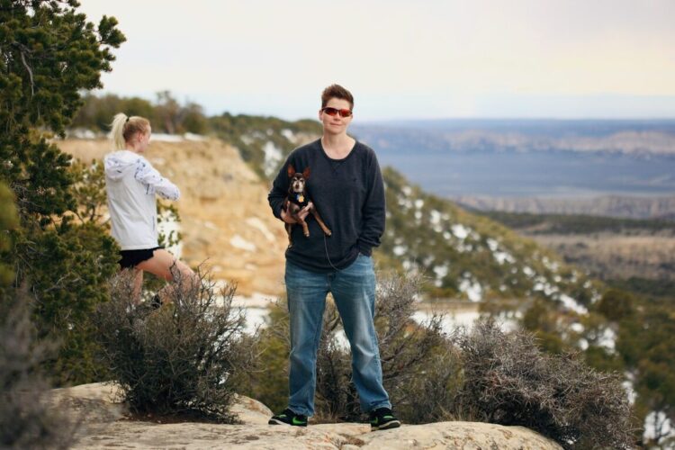 man in black crew neck t-shirt standing beside woman in white t-shirt during daytime