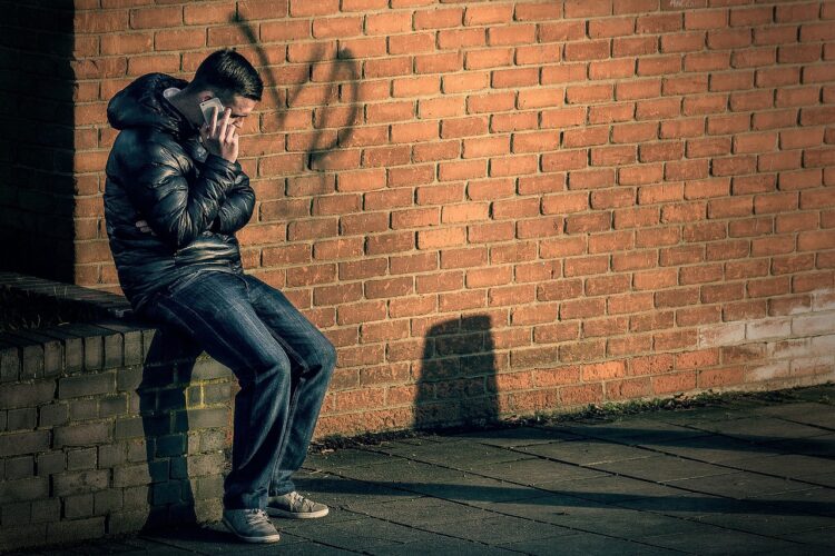 people, man, street, fashion, cellphone, call, talk, shadown, sit, wall, brown talk, brown talking, people, man, talk, talk, talk, talk, talk, shadown, shadown