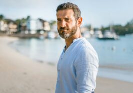 man standing on beach during daytime