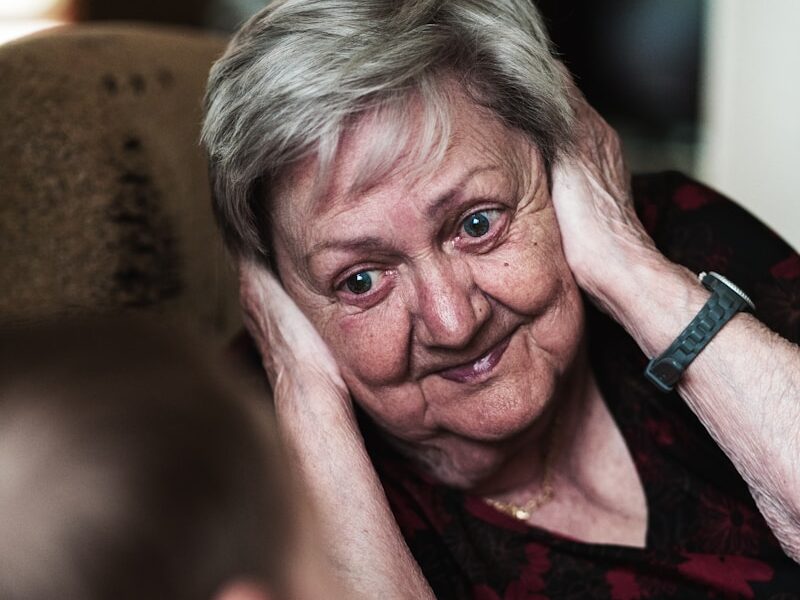 woman covering her ears photo
