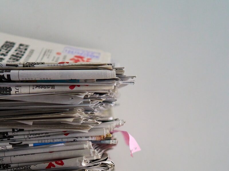 assorted newspapers on top of table