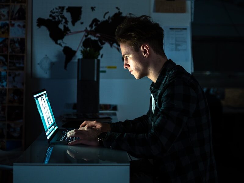 man sitting in front of a computer