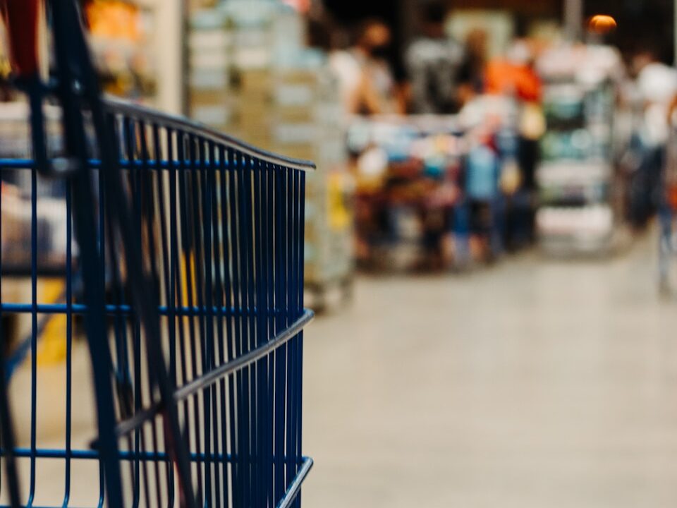 blue shopping cart on street during daytime