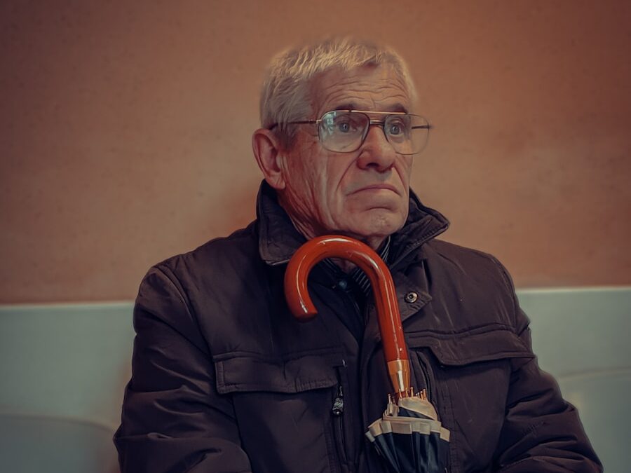 man in black jacket wearing eyeglasses