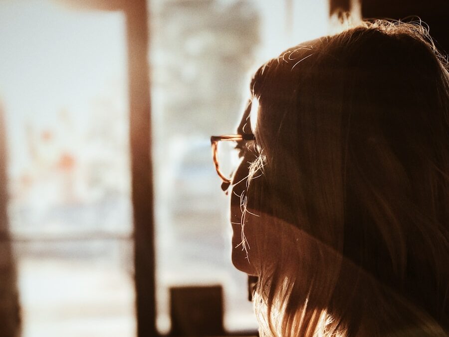 shallow focus photography of woman facing door