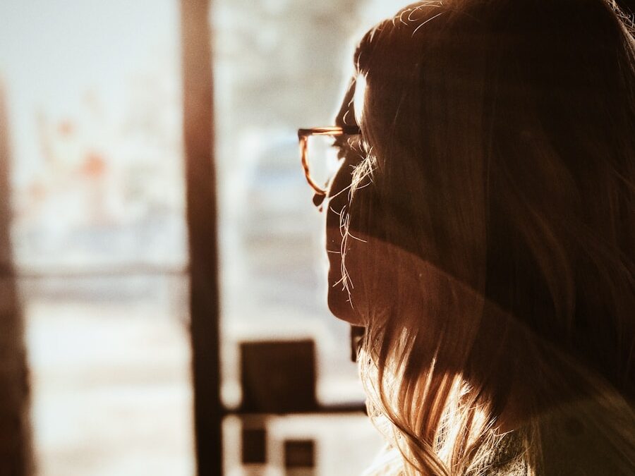 shallow focus photography of woman facing door