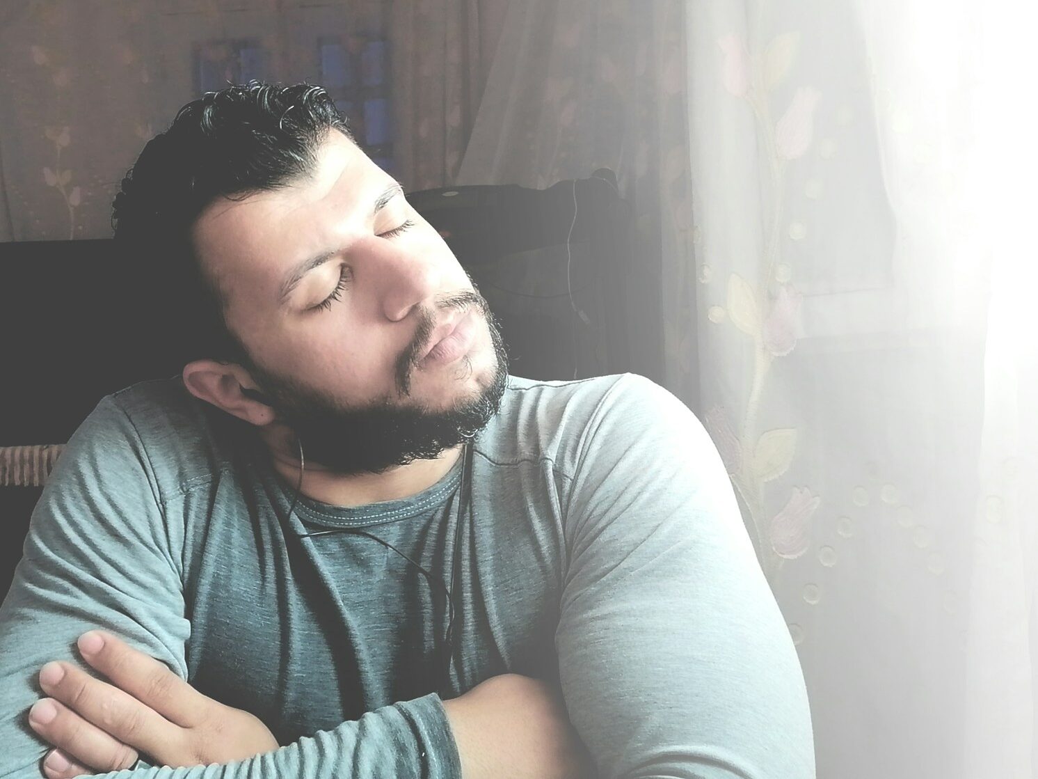 a man with his eyes closed