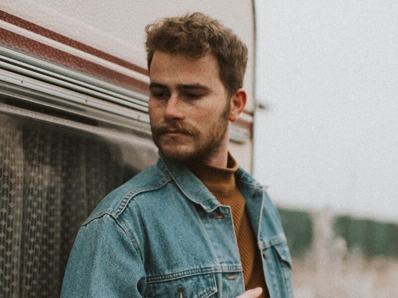 man in blue denim jacket