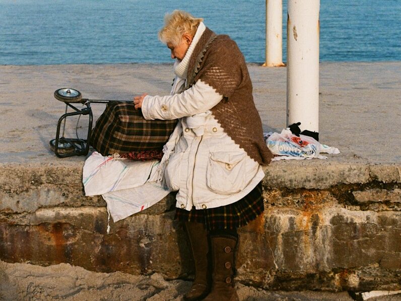 a person sitting on a bench