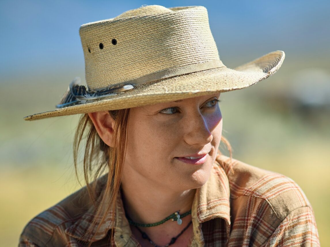 woman in beige hat