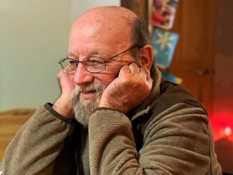 man resting his head on the table