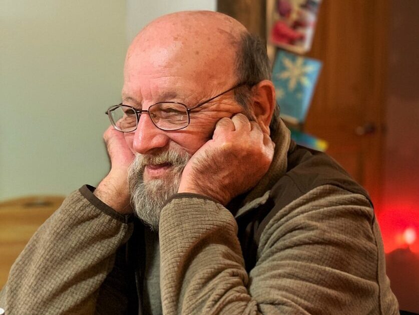 man resting his head on the table