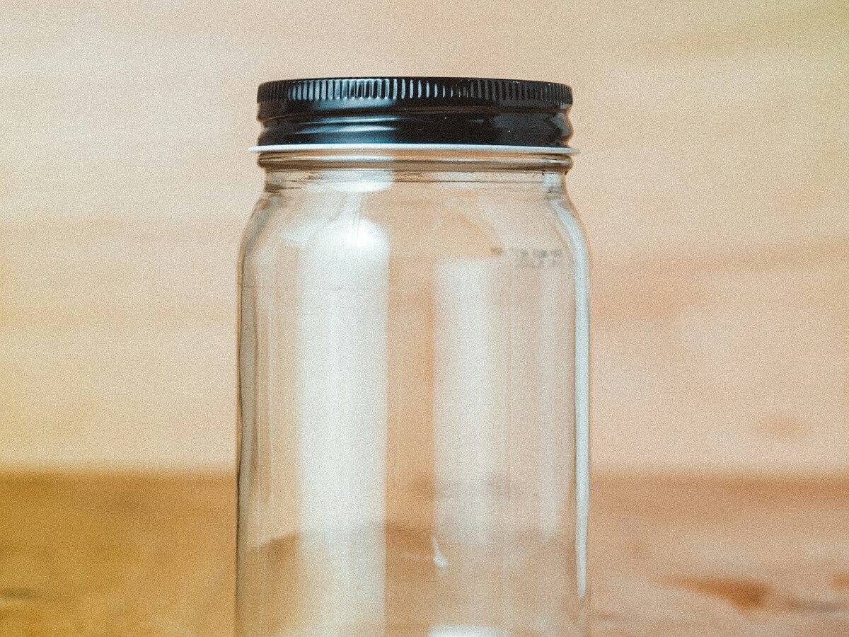 clear glass jar with white powder inside