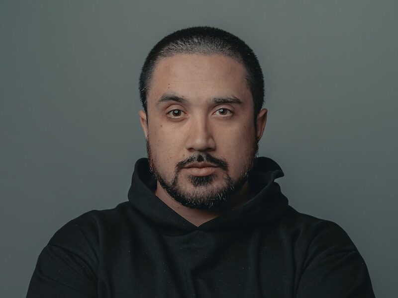 man in black hoodie standing