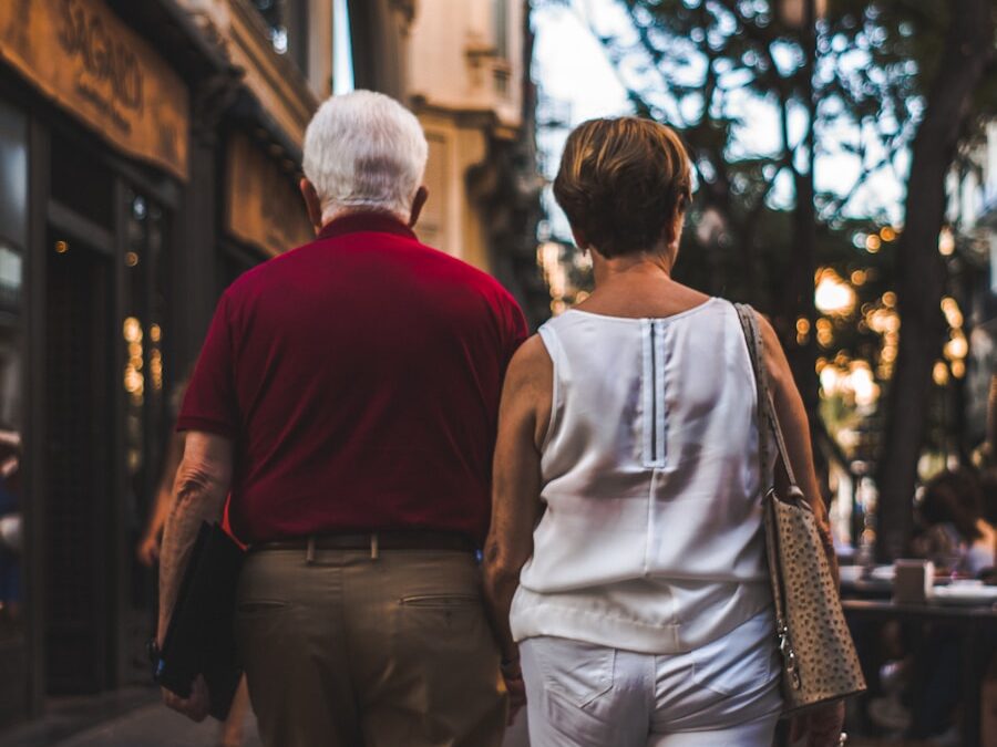 a man and a woman walking down a street