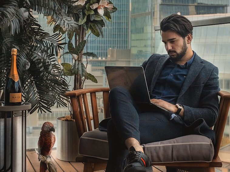 man sitting beside side table