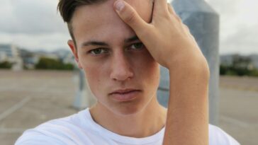 men's white crew-neck top close-up photography