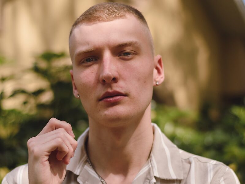 a man in a shirt is posing for a picture