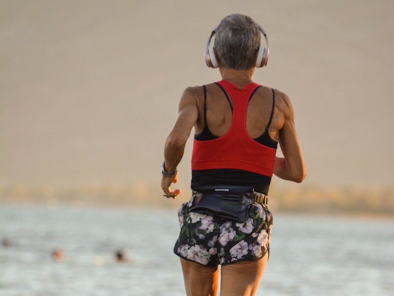 a boy walking on a beach