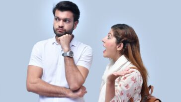 a man and woman looking at each other