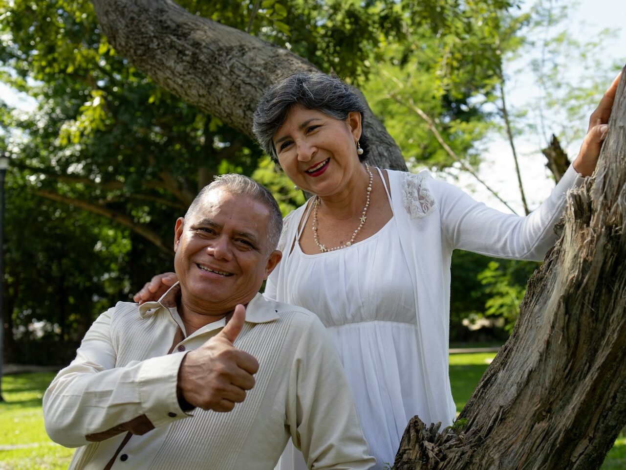Happy senior couple poses for a photo outdoors.