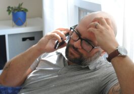a man with glasses and a watch