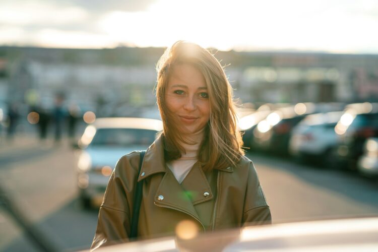 a woman in a green jacket