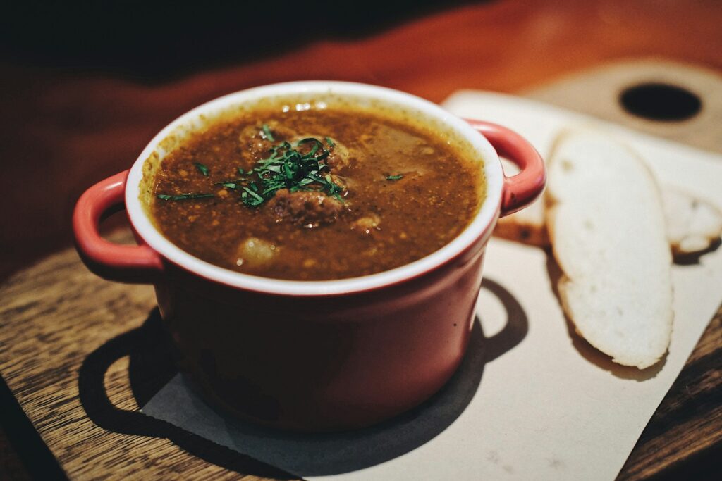 soup in maroon ceramic pot
