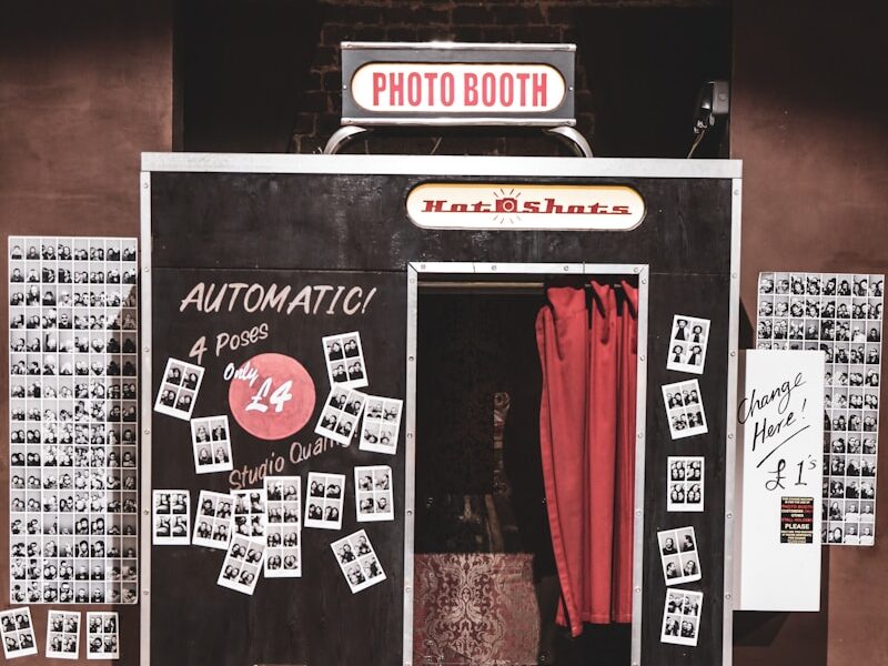 black and white photo booth showing open door