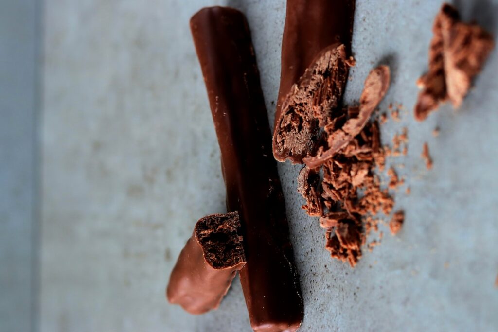 a couple of pieces of chocolate sitting on top of a counter