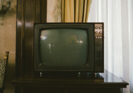 turned-off gray CRT TV on table