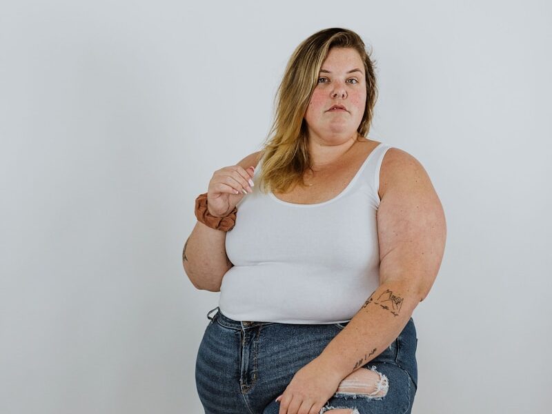 a woman sitting on a stool