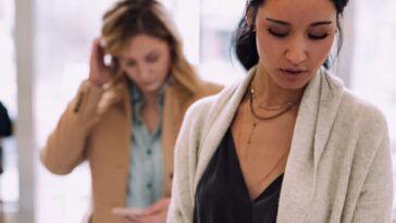 woman using white device