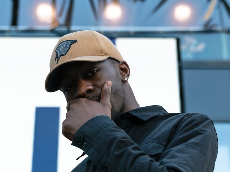 man wearing brown cap